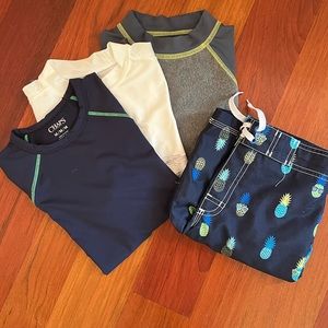 Boys swim trunks and three swim shirts